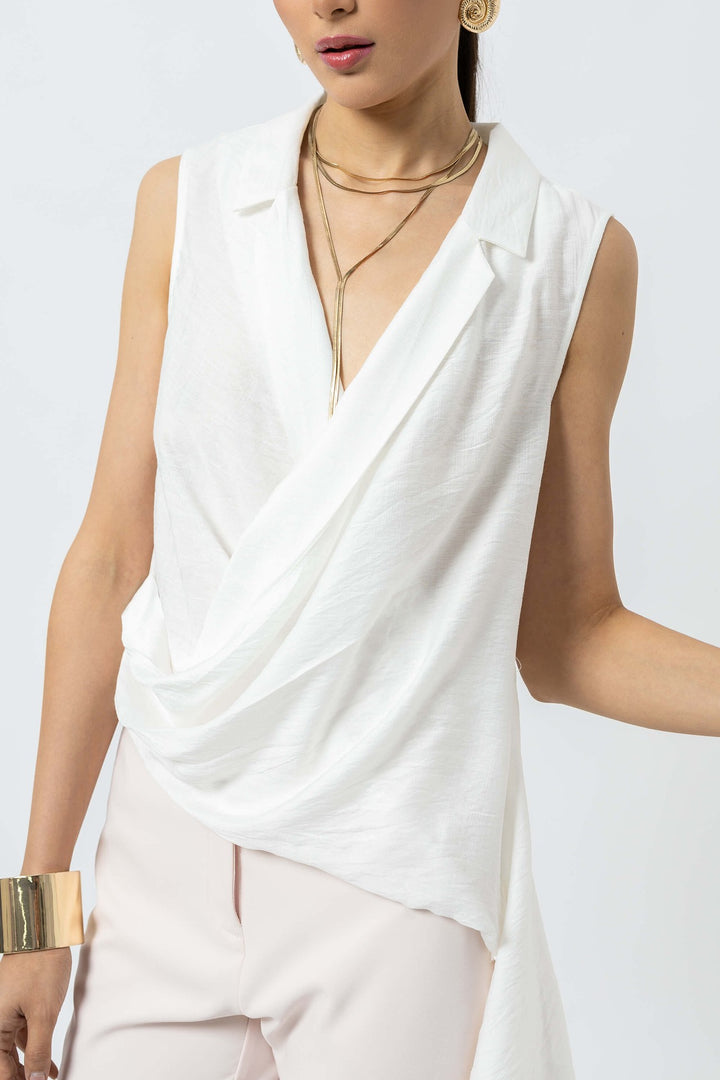 Blusa asimétrica con drapeado