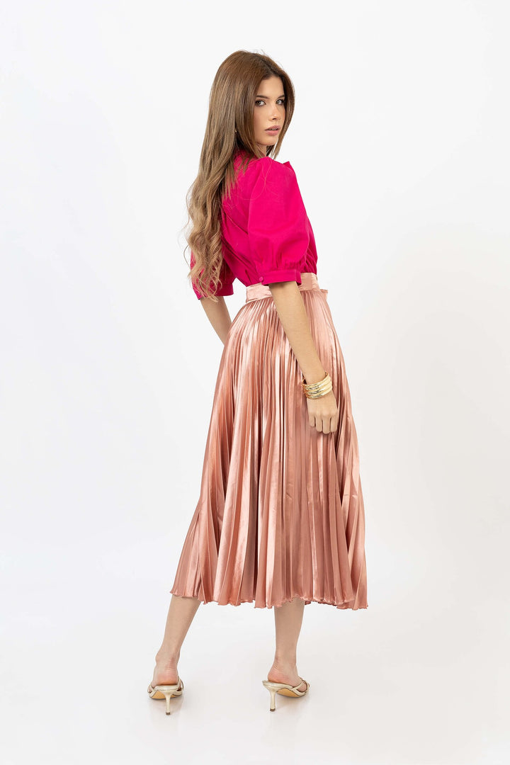 Blusa elegante con moño y manga abullonada