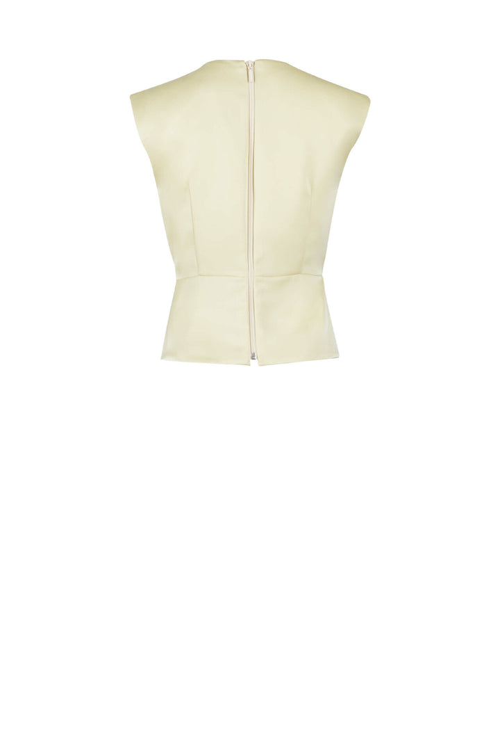 Blusa elegante con flor y moño