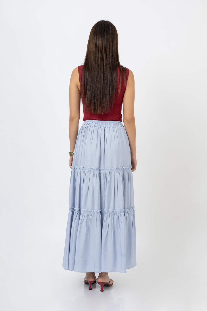 Blusa asimétrica con detalle dorado