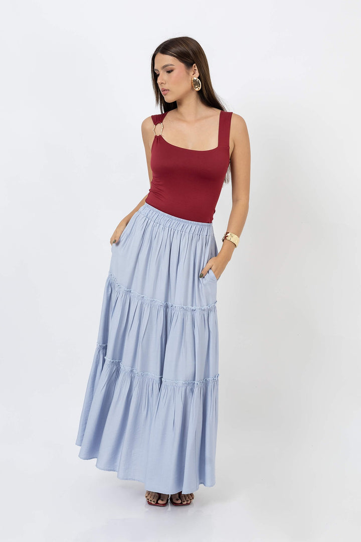 Blusa asimétrica con detalle dorado