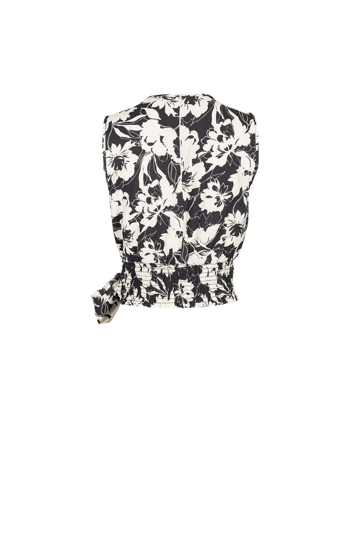 Blusa con moño lateral