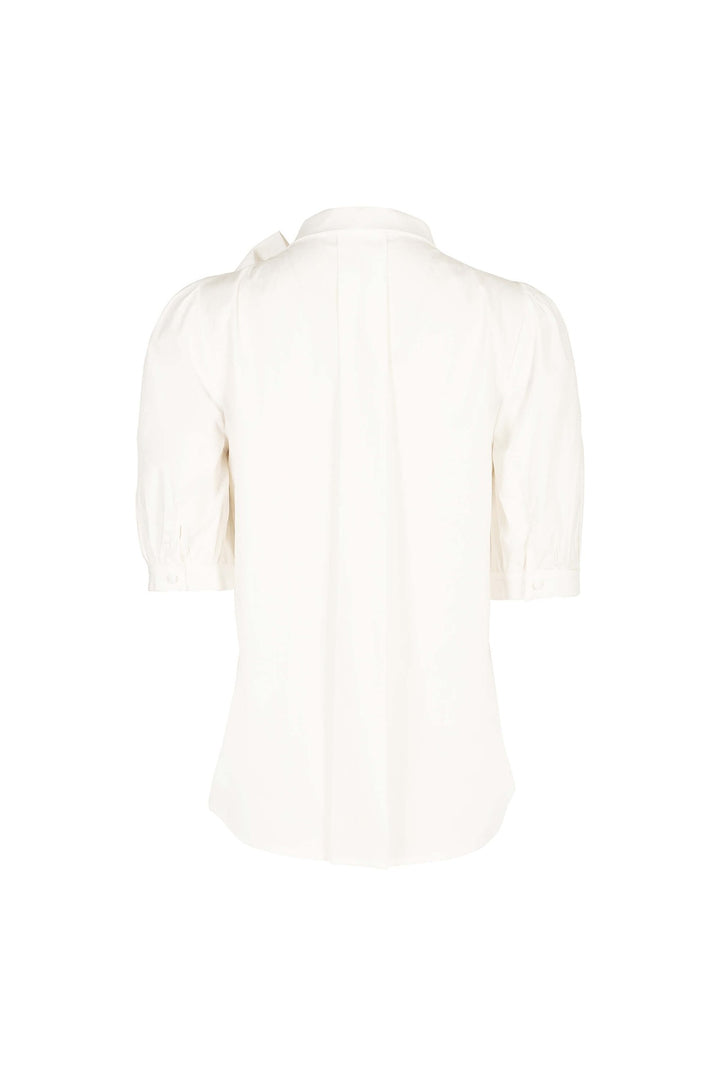Blusa elegante con moño y manga abullonada