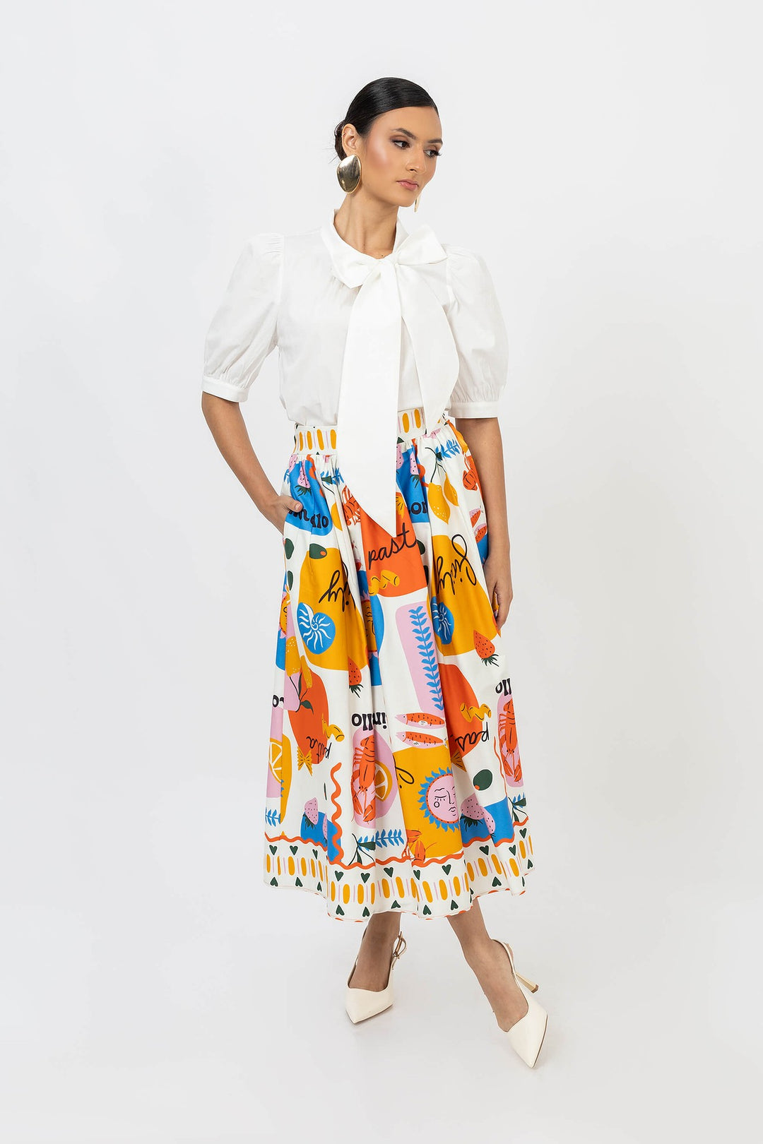 Blusa elegante con moño y manga abullonada