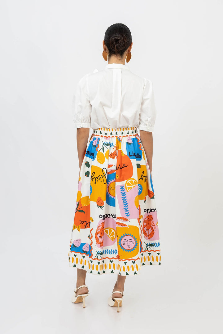 Blusa elegante con moño y manga abullonada