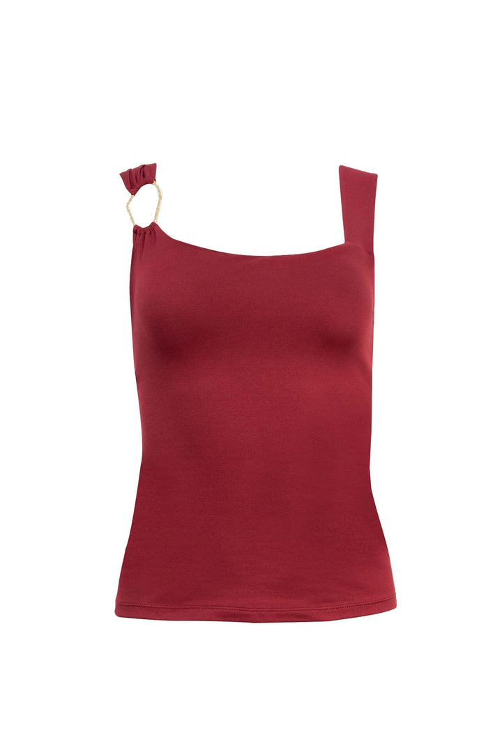 Blusa asimétrica con detalle dorado