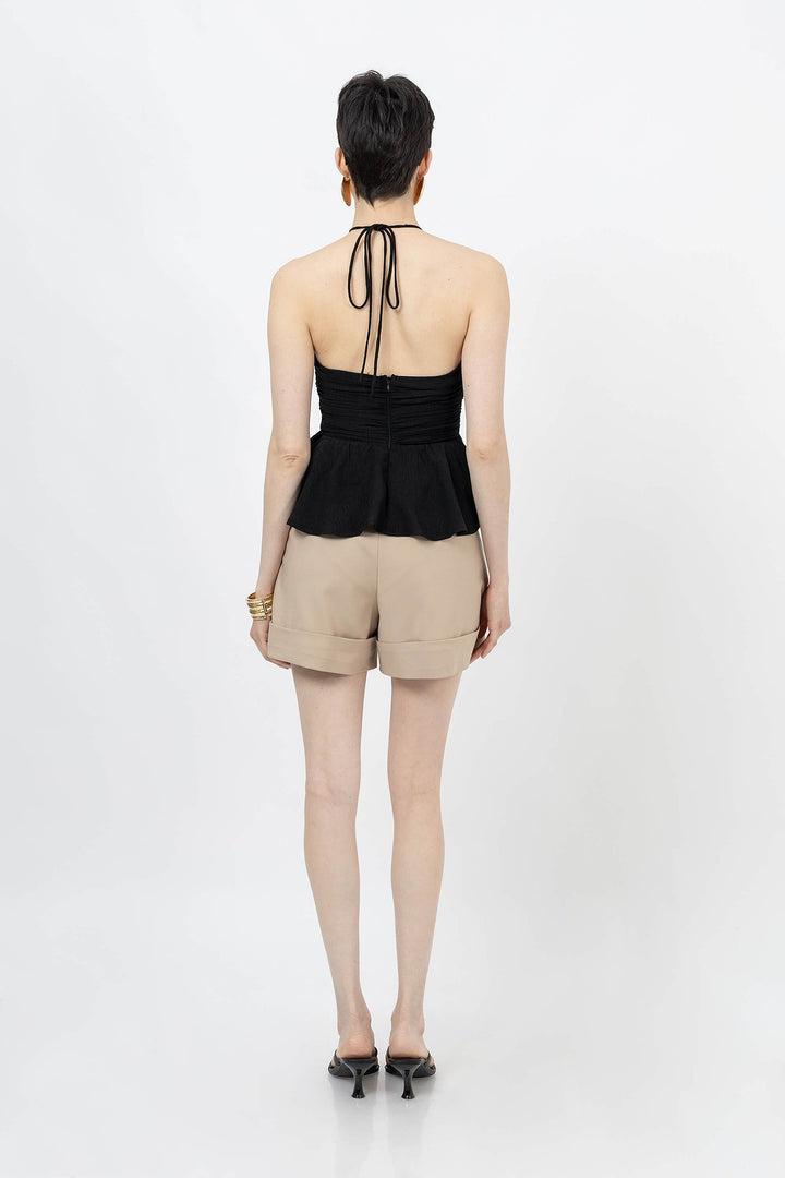 Blusa halter con fruncido y silueta peplum