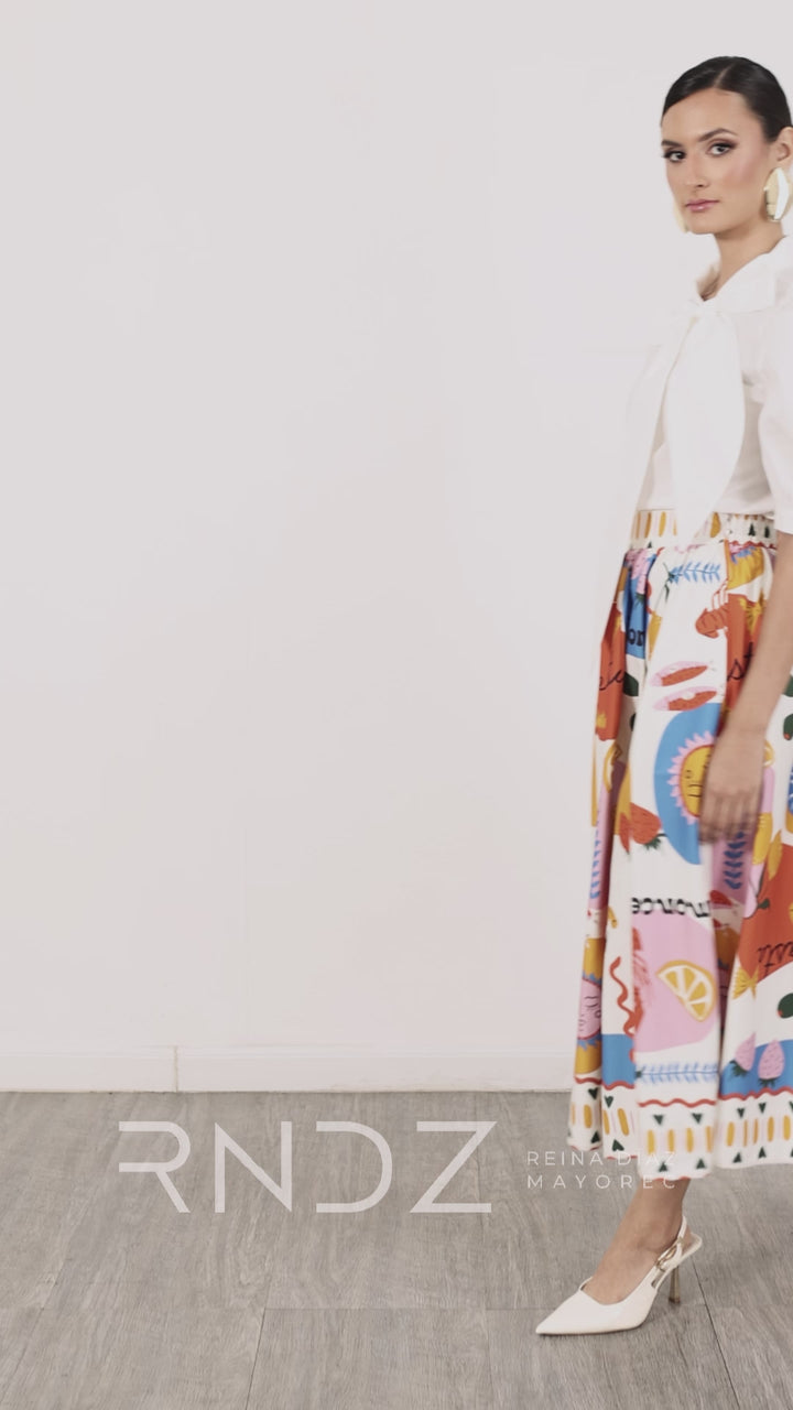 Blusa elegante con moño y manga abullonada